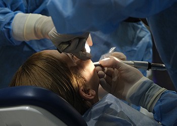 Woman getting dental surgery