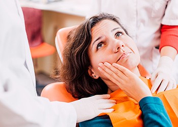 Woman at the dentist with a toothache