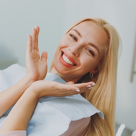 Happy dental patient showing off her smile